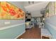 Open floor plan showcasing the living room with hardwood floors at 23516 Peachland Blvd, Port Charlotte, FL 33954