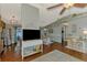 Open-concept floor plan showcasing seamless transition from living room to dining area with hardwood floors and neutral tones at 23516 Peachland Blvd, Port Charlotte, FL 33954