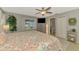Spacious main bedroom featuring tiled floor, neutral walls, windows overlooking pool and ensuite bath at 23516 Peachland Blvd, Port Charlotte, FL 33954