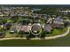 A beautiful aerial view of a lakeside home surrounded by lush greenery and serene water, perfect for tranquil living at 24477 Lakeside Mnr, Punta Gorda, FL 33980