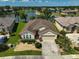 Aerial view of the house showcasing the large lot and water view at 24477 Lakeside Mnr, Punta Gorda, FL 33980