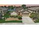 Charming home boasts a well-manicured lawn, mature landscaping, and a serene waterfront view at 24477 Lakeside Mnr, Punta Gorda, FL 33980