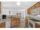 Eat-in kitchen features matching appliances and wood cabinets at 24477 Lakeside Mnr, Punta Gorda, FL 33980