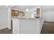 Functional kitchen features warm wood cabinets, modern appliances, and a convenient breakfast bar at 24477 Lakeside Mnr, Punta Gorda, FL 33980
