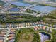 Beautiful aerial shot of homes in a community surrounded by lakes and green space at 264 Caserta Ct, Nokomis, FL 34275