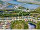 Stunning aerial view of the community with lakes, lush greenery, and well-maintained homes at 264 Caserta Ct, Nokomis, FL 34275