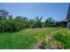 Spacious backyard with lush landscaping offering privacy and tranquility at 264 Caserta Ct, Nokomis, FL 34275