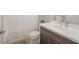Bright bathroom featuring vanity with modern fixtures and a shower with white textured curtain at 264 Caserta Ct, Nokomis, FL 34275
