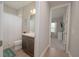 Bathroom with a shower, vanity, and a glimpse into an adjoining bedroom at 264 Caserta Ct, Nokomis, FL 34275