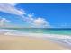 A beautiful, serene beach with clear water and gentle waves lapping the sandy shore at 264 Caserta Ct, Nokomis, FL 34275