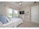 Bedroom with a ceiling fan, windows, a dresser, and a wall mounted TV at 264 Caserta Ct, Nokomis, FL 34275