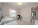 Well-lit bedroom featuring a ceiling fan and a dedicated desk and workspace at 264 Caserta Ct, Nokomis, FL 34275