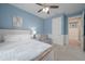 Light and airy bedroom featuring a cozy armchair, soft carpet, and a serene atmosphere at 264 Caserta Ct, Nokomis, FL 34275