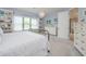 Bedroom showcasing built-in shelving, natural light, and a comfortable bed with decorative pillows at 264 Caserta Ct, Nokomis, FL 34275