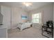 Neutral bedroom with a simple design, including a ceiling fan and desk setup at 264 Caserta Ct, Nokomis, FL 34275