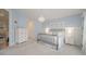 Comfortable bedroom featuring soft blue walls, white trim, and two nightstands with lamps at 264 Caserta Ct, Nokomis, FL 34275