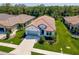 Beautiful aerial view of the charming single-Gathering home with a well-manicured lawn and a tile roof at 264 Caserta Ct, Nokomis, FL 34275