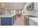 Elegant kitchen with stainless steel appliances, a center island and white cabinetry at 264 Caserta Ct, Nokomis, FL 34275