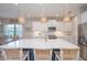Beautiful kitchen with a large island, pendant lighting, stainless steel appliances, and ample counter space at 264 Caserta Ct, Nokomis, FL 34275