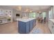 Modern kitchen featuring an island, quartz countertops, pendant lighting and stainless steel appliances at 264 Caserta Ct, Nokomis, FL 34275