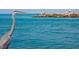 Great Blue Heron near people fishing off a rock breakwater into the sea at 264 Caserta Ct, Nokomis, FL 34275