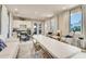 Bright clubhouse interior featuring a kitchenette, dining area, and comfortable seating with large windows at 268 Ibiza Loop, Venice, FL 34292
