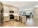 Stylish kitchen with stainless steel appliances and an open view to the dining room at 268 Ibiza Loop, Venice, FL 34292