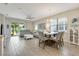 Spacious living room features neutral color palette and sliding glass doors to patio at 268 Ibiza Loop, Venice, FL 34292