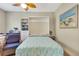 Bright office/bedroom featuring a murphy bed and woven chairs at 268 Ibiza Loop, Venice, FL 34292