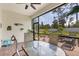 Charming screened patio featuring a table and chairs, perfect for outdoor dining and relaxation at 268 Ibiza Loop, Venice, FL 34292