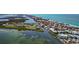 Panoramic aerial view features the inter-coastal waterway and gulf-front condo community at 2955 N Beach Rd # A422, Englewood, FL 34223