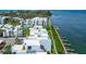 Aerial showcases beachfront condos with boat docks and nearby beach access at 2955 N Beach Rd # A422, Englewood, FL 34223