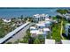 Aerial view of condos with community pool, bay views, and covered parking at 2955 N Beach Rd # A422, Englewood, FL 34223