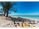 Beach access with wooden walkway leading to sandy beach and beautiful ocean views at 2955 N Beach Rd # A422, Englewood, FL 34223
