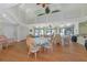 The dining area showcases elegant wicker chairs and tables, complemented by stunning backyard views at 2955 N Beach Rd # A422, Englewood, FL 34223