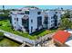 An exterior angle view of a multi-story modern building near the waterfront at 2955 N Beach Rd # A422, Englewood, FL 34223