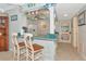 Charming bar-top kitchen area with ample wine glass storage and seating, perfect for entertaining at 2955 N Beach Rd # A422, Englewood, FL 34223