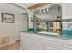 The kitchen has a breakfast bar overlooking the Gathering room with ample counterspace and open archway at 2955 N Beach Rd # A422, Englewood, FL 34223