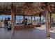 Live music venue featuring a musician on stage at a covered outdoor venue at 2955 N Beach Rd # A422, Englewood, FL 34223