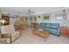 Open-concept living and dining room with tile floors, ample natural light, and water-inspired decor at 2955 N Beach Rd # A422, Englewood, FL 34223