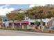 Inviting restaurant featuring outdoor patio seating and vibrant red umbrellas at 2955 N Beach Rd # A422, Englewood, FL 34223