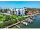 Beautiful waterfront home featuring a marina, lush landscaping, and community pool at 2955 N Beach Rd # A422, Englewood, FL 34223