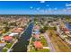 Aerial view of the neighborhood showcasing the waterfront community and canal access at 322 Oakwood Cir, Englewood, FL 34223