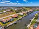This stunning aerial view showcases waterfront homes with private boat docks along a scenic canal at 322 Oakwood Cir, Englewood, FL 34223