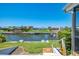 Expansive backyard featuring a private dock and waterfront views at 322 Oakwood Cir, Englewood, FL 34223