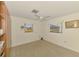 Bedroom with neutral carpet, ceiling fan, and views of the pool area at 322 Oakwood Cir, Englewood, FL 34223