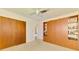 Bedroom with built-in storage and ceiling fan at 322 Oakwood Cir, Englewood, FL 34223