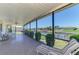 Spacious screened lanai offering serene views of the canal at 322 Oakwood Cir, Englewood, FL 34223
