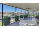 Enclosed lanai with comfortable seating and lovely canal views at 322 Oakwood Cir, Englewood, FL 34223