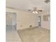 Comfortable living room with a ceiling fan, neutral walls, and access to other rooms at 322 Oakwood Cir, Englewood, FL 34223